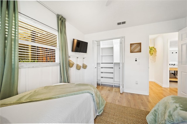 85 Comanche Ct, Palm Coast, FL 32137 - bedroom with light wood-style floors, a ceiling fan, baseboards, and a closet