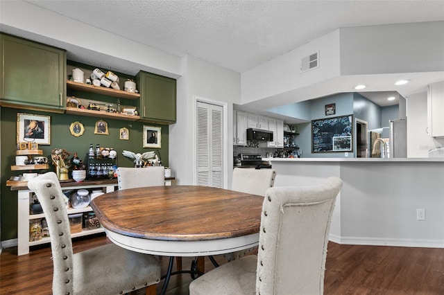 dining space featuring dark wood-style flooring, visible vents, and baseboards