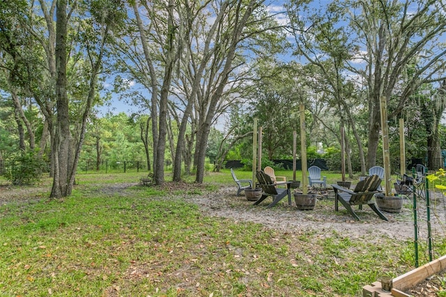 view of yard with an outdoor fire pit