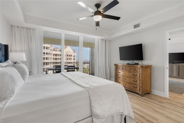 bedroom featuring a ceiling fan, visible vents, baseboards, access to outside, and light wood finished floors