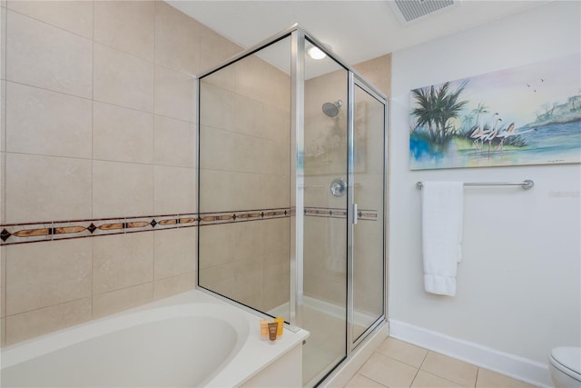 full bathroom featuring a stall shower, tile patterned flooring, visible vents, and a bath