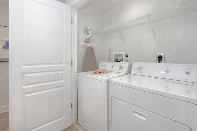 laundry area featuring laundry area and washer and clothes dryer