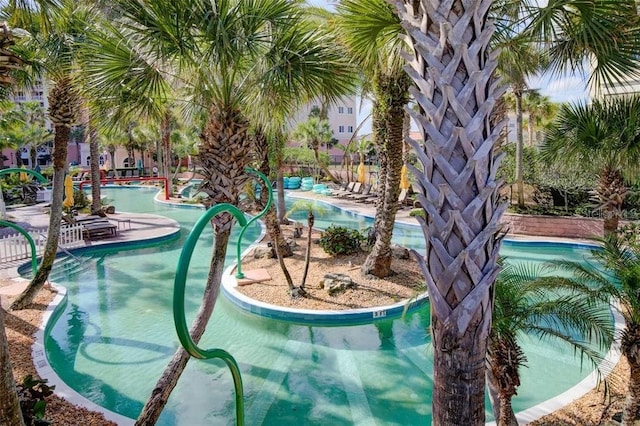 view of swimming pool featuring a water play area