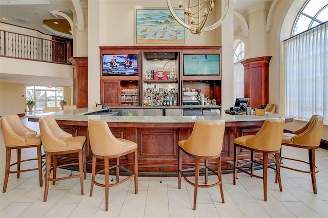 bar with a high ceiling and a community bar