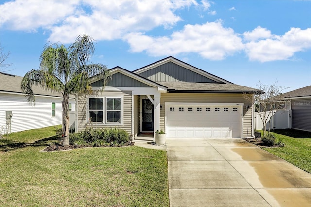 view of front of home featuring concrete driveway, an attached garage, fence, board and batten siding, and a front yard