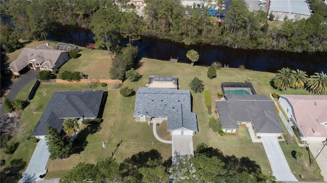 drone / aerial view featuring a water view and a residential view