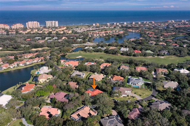 birds eye view of property with a residential view and a water view