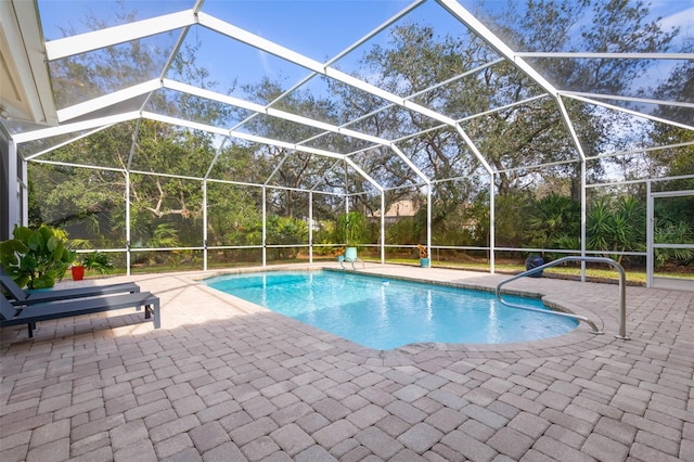 pool with a patio area and a lanai