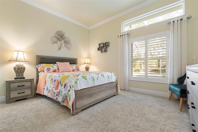 carpeted bedroom featuring ornamental molding and baseboards