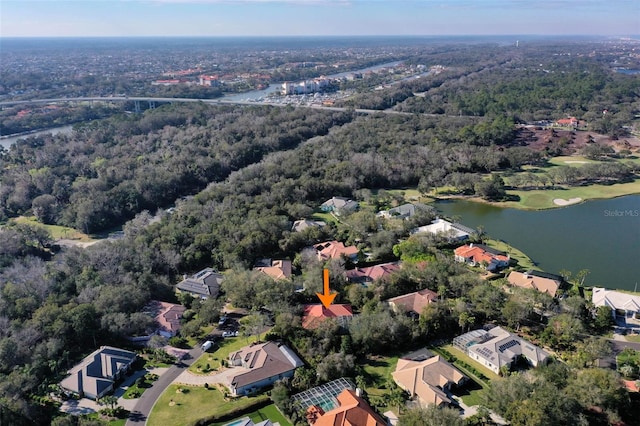 aerial view with a water view, a residential view, and a wooded view