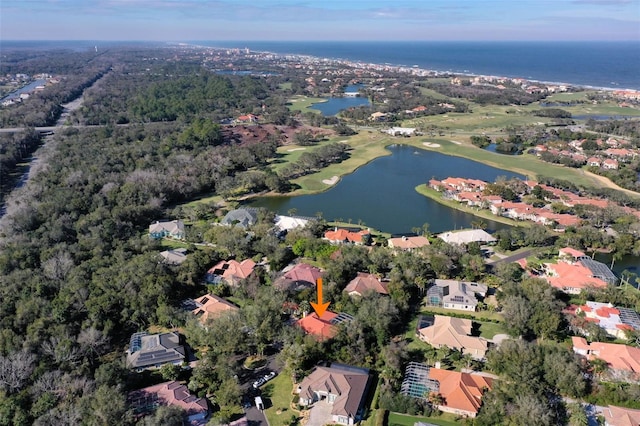 birds eye view of property with a residential view and a water view