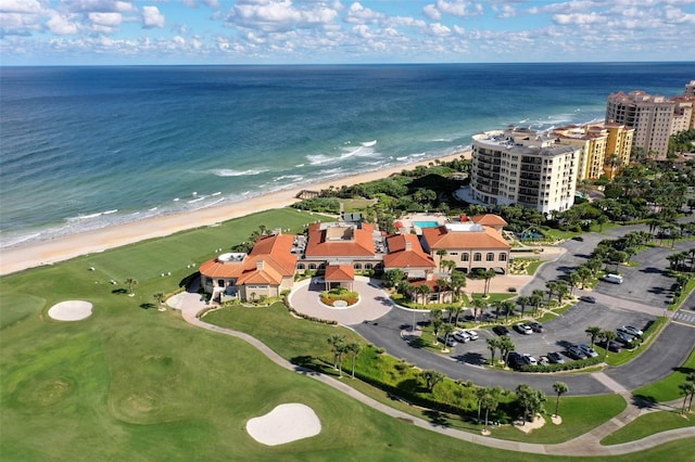 bird's eye view featuring a view of the beach, a water view, and a city view