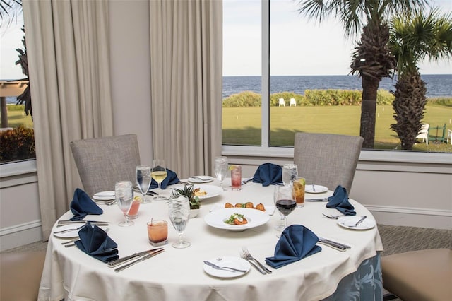 dining room with a water view