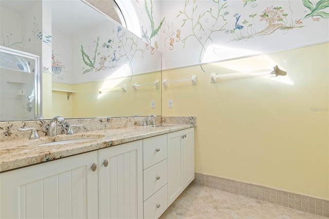 bathroom with a stall shower, tile patterned floors, a sink, and double vanity