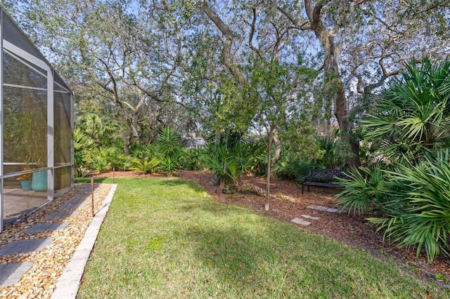 view of yard featuring a lanai