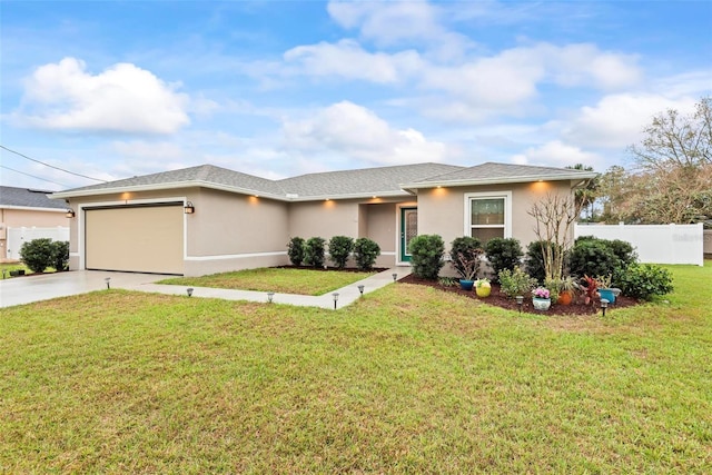 view of front of home with stucco siding, concrete driveway, a front yard, fence, and a garage