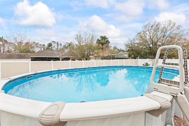 view of swimming pool with fence and a fenced in pool