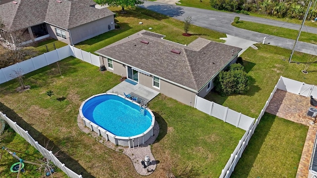 view of swimming pool with a fenced in pool and a fenced backyard