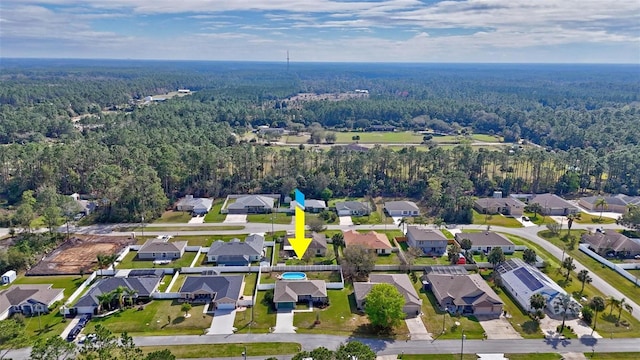 bird's eye view featuring a residential view and a view of trees