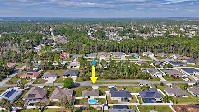 birds eye view of property with a residential view