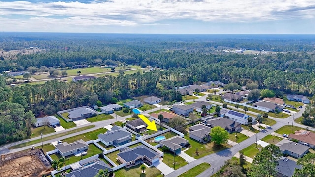 bird's eye view featuring a residential view and a view of trees