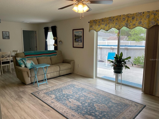 8 Smoke Tree Pl, Palm Coast, FL 32164 - living area featuring wood finished floors and a ceiling fan