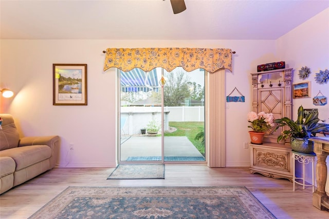 8 Smoke Tree Pl, Palm Coast, FL 32164 - living room featuring wood finished floors and a ceiling fan