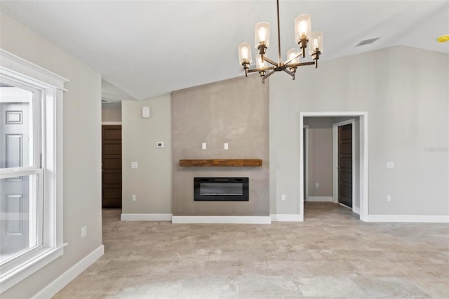 unfurnished living room with baseboards, visible vents, a glass covered fireplace, lofted ceiling, and heating unit