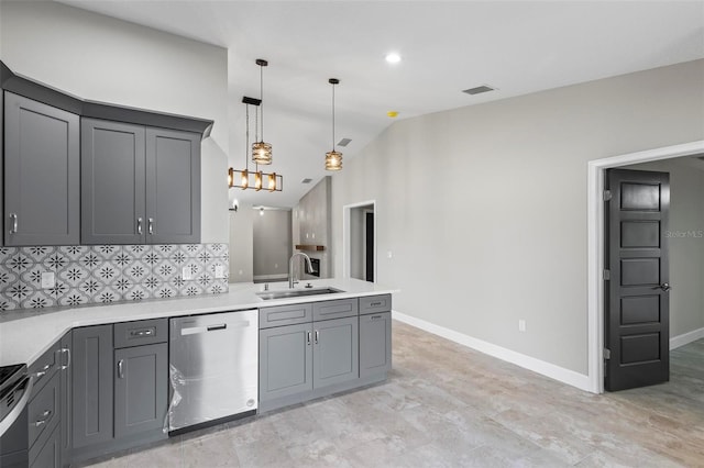 kitchen featuring visible vents, a peninsula, gray cabinets, stainless steel dishwasher, and a sink