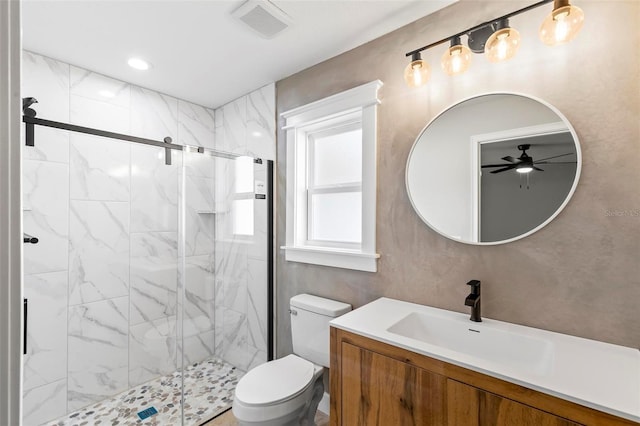 bathroom with toilet, a marble finish shower, visible vents, and vanity