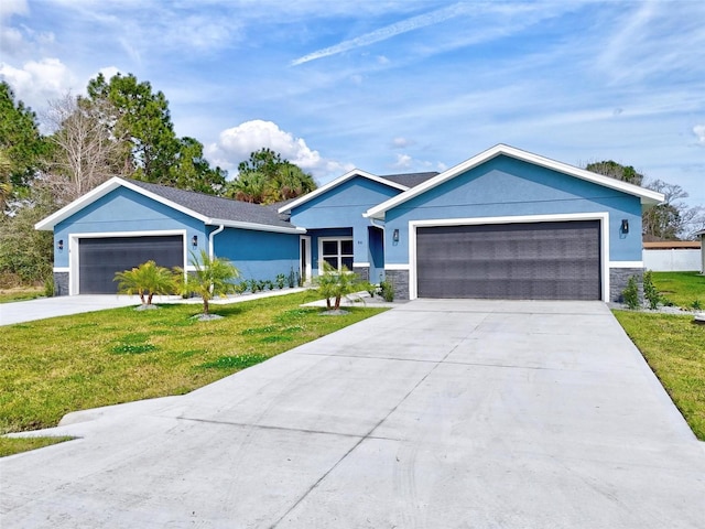 ranch-style house with stucco siding, concrete driveway, an attached garage, stone siding, and a front lawn