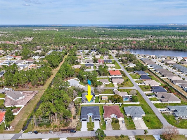 aerial view featuring a water view, a forest view, and a residential view