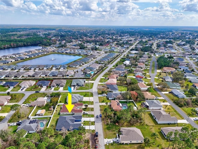 aerial view with a water view and a residential view