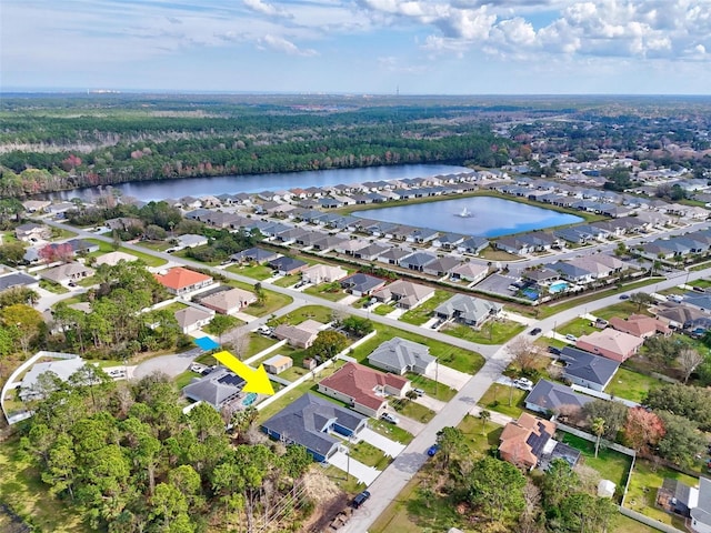 bird's eye view featuring a water view and a residential view