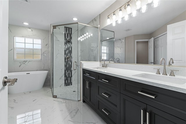 full bath featuring marble finish floor, a sink, and a marble finish shower