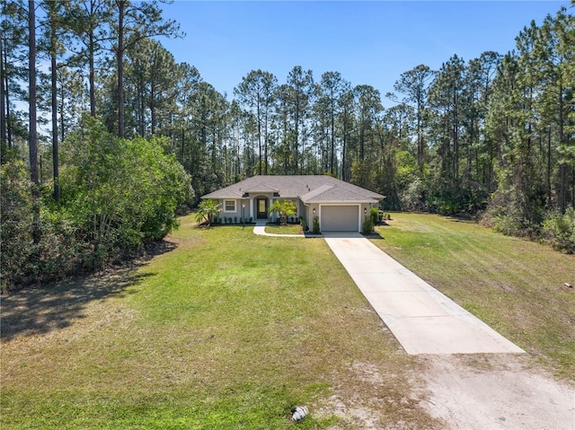 view of front of property with a garage, driveway, and a front lawn