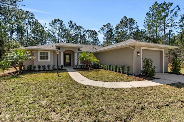 view of front of property with a garage, driveway, a front lawn, and stucco siding