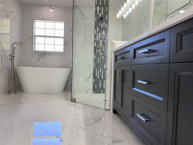 full bath with marble finish floor, a marble finish shower, stone wall, and a freestanding tub