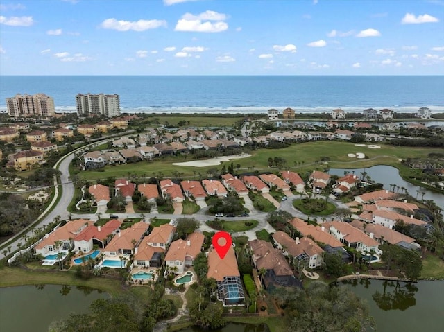 birds eye view of property featuring a residential view and a water view