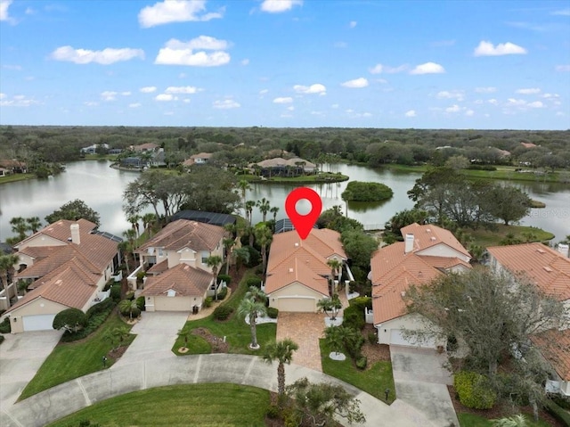 bird's eye view featuring a water view and a residential view