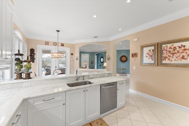 kitchen featuring dishwasher, ornamental molding, light tile patterned floors, white cabinets, and a sink