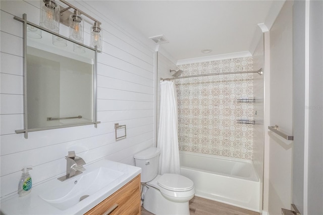 full bath with visible vents, shower / bathtub combination with curtain, toilet, wooden walls, and vanity