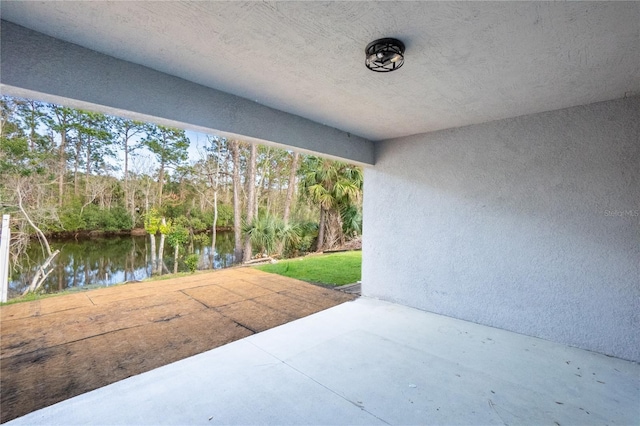 view of patio / terrace featuring a water view