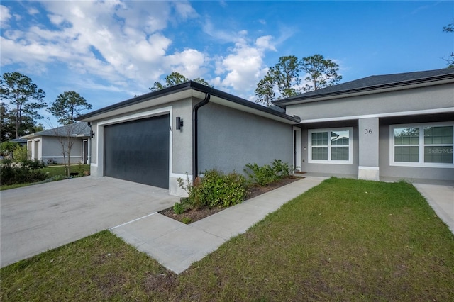 view of home's exterior featuring a yard, driveway, an attached garage, and stucco siding