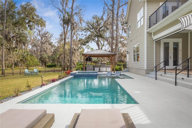 view of pool with fence, a gazebo, french doors, a lawn, and a patio area