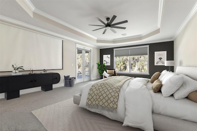 bedroom featuring baseboards, a raised ceiling, ornamental molding, access to exterior, and carpet floors