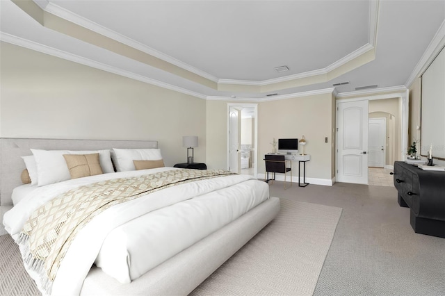 bedroom featuring arched walkways, a tray ceiling, ornamental molding, carpet flooring, and baseboards