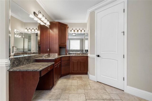 full bathroom featuring ornamental molding, stone tile flooring, vanity, and baseboards