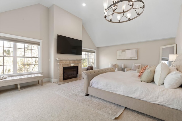 bedroom with baseboards, a chandelier, a tile fireplace, carpet floors, and high vaulted ceiling