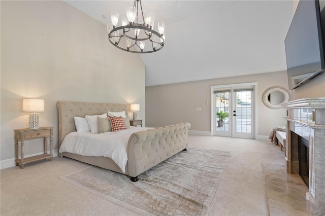 bedroom with carpet, access to outside, a fireplace, and baseboards